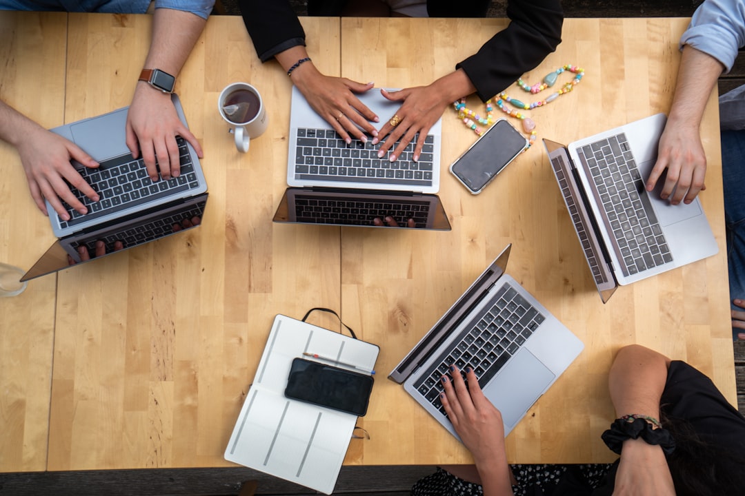 services-03 person-using-macbook-pro-on-brown-wooden-table-5ehn4wbfvbc